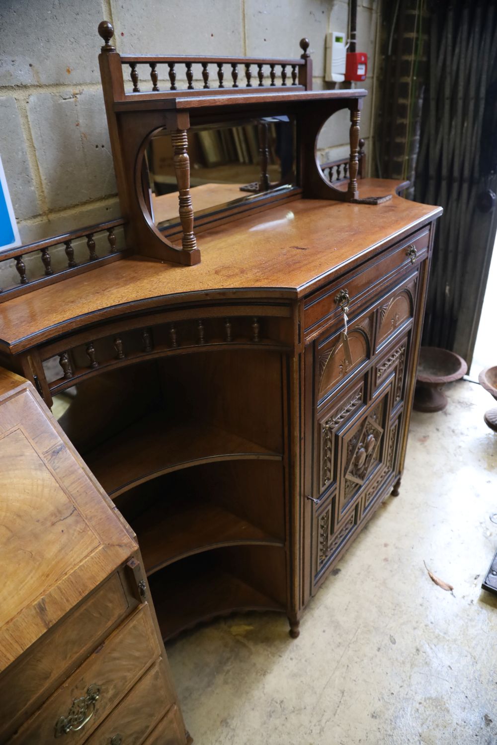 A late Victorian aesthetic movement mahogany side cabinet, width 150cm, depth 43cm, height 147cm